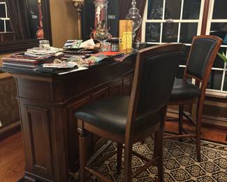 3 piece bar includes two bar stools with black leather, black granite top, plenty of storage for glassware, liquor bottles, and integrated wine rack