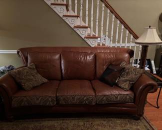 Leather and upholstery couch (note, other side of cushions are full upholstery for various looks)