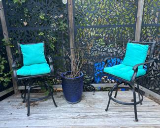 two metal swivel barstools