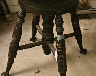 Piano Stool with ball and claw feet.