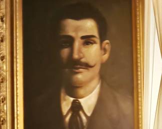 Portrait by L Girsh, oil on canvas.