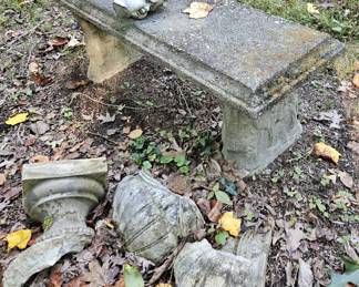 Outdoor bench and urn remains.