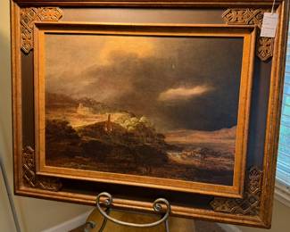 Reproduction of landscape painting in an ornate gilt frame. 