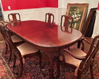 Dining table with 6 chairs and leaf . Location downstairs dining room .