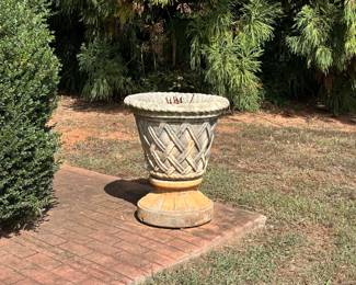 Concrete planter located front of house 
