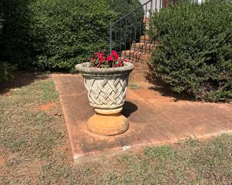 Concrete planters located front of house 