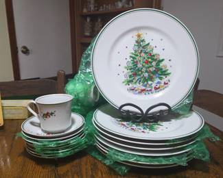 Salem China "Christmas Eve" collection. The pattern features a mid-century style Christmas tree with a snowy village scene at its base, and a green and gold trim around the edges. The collection was designed by Viktor Schreckengost and was first advertised as early as 1953.  $150