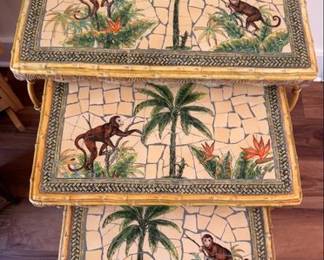 Nesting tables with monkey motif tile tops and faux bamboo frames
