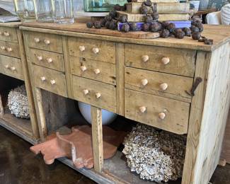 Antique apothecary tables on casters repurposed for kitchen island
