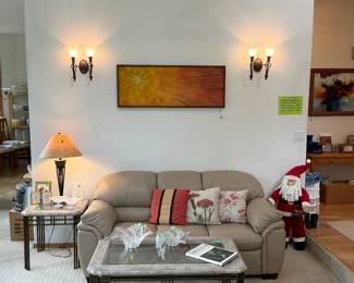 Part of the leather set with a Mid-Century Impasto Painting by Russell. More simple, but elegant is the marble and beveled glass coffee table with matching side tables.