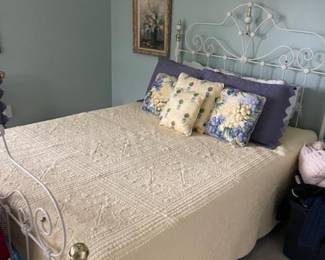 Beautiful metal bed (headboard, footboard and frame).  The mattress and box springs are not included in this case.