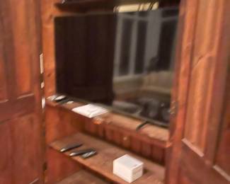 One of two large screen TVs