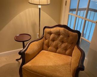 Pretty armchair and brass lamp. Great to cozy up in for some reading