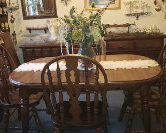 Diningroom table has 3 leaf, 6 chairs solid wood
