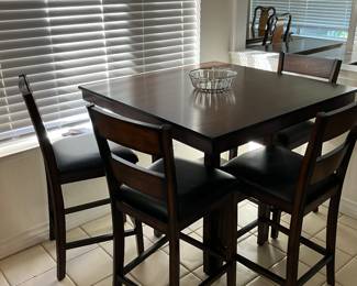 Counter top table w/ four chairs