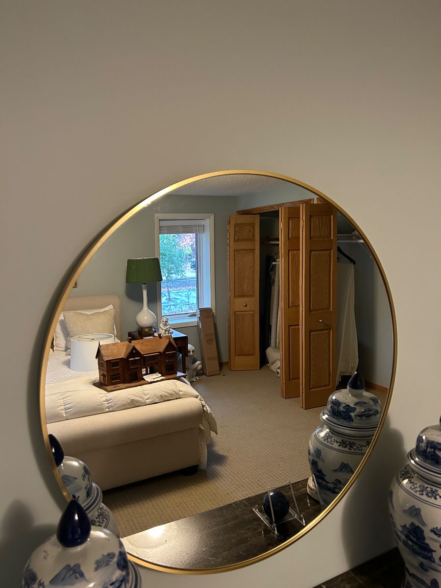 Round gold framed mirror