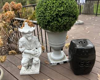 Italian ceramic monkey , Ballard boxwood balls in urns, black ceramic garden stools.
