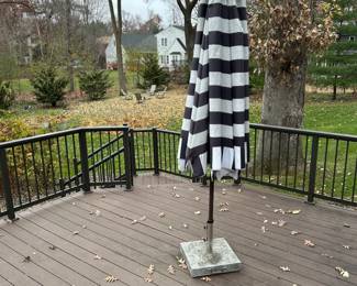 Large outdoor umbrella in heavy duty stand