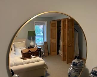 Round gold framed mirror