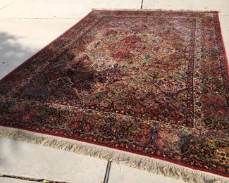 8'8" x 12' Karastan rug with animal damage