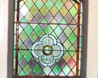 Stained glass window with old heavy wooden frame
