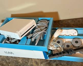 E82 - $85. Wii Bundle. Powers on and ejects!