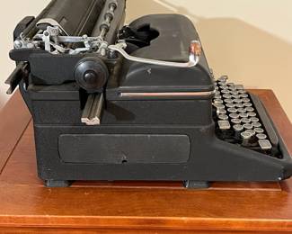 E59 - $75. Royal Typewriter. KMM Model I believe. All keys move.