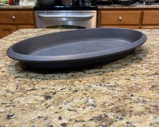 E41 - $30. Le Creuset Non Enameled Cast Iron. Measures 17" x 10".
