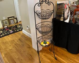 E105 - $30. 3 Tier Swinging Basket for storage. Measures 14" wide x 50" tall.