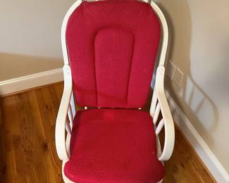 E57 - $40. White glider rocker. Has one small hole in cushion. Measures 21" wide x 40" tall.