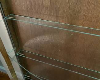E44 - $100. Bow front curio with 3 glass shelves. Measures 34.5" wide x 14.25" deep x 57" tall.
