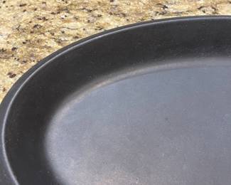 E41 - $30. Le Creuset Non Enameled Cast Iron. Measures 17" x 10".