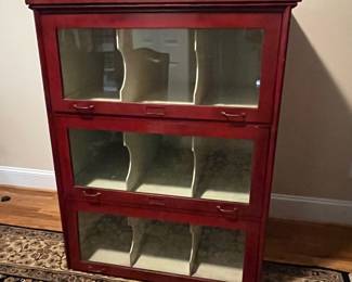 E25 - $650. Antique Cabinet. One Piece. Barrister Style Glass Doors that pull down to protect merchandise. I believe this was also from an old store. Measures 38.25" wide x 26.5" deep x 49" tall.