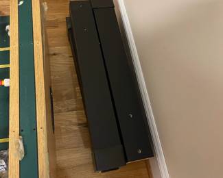 E109 - $50. Foosball Table. Was stored in the attic so the legs were already off. Legs, Hardware & Game Table all included.
