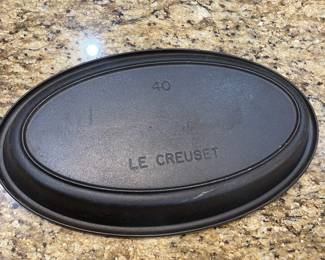 E41 - $30. Le Creuset Non Enameled Cast Iron. Measures 17" x 10".