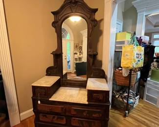 E92 - $550. Eastlake Dresser/ Vanity. Used as Entry Cabinet. Measures 50" wide x 20" deep x 98" tall. This is right inside the front door but you need to plan for help to move. Veneer is peeling but actually looks intentional in person.