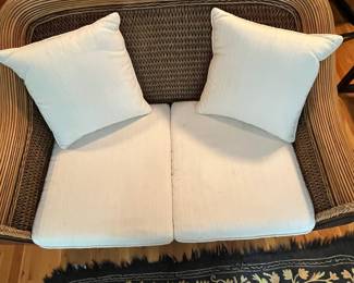 E55 - $125. Wicker & Wood Oversized Loveseat Padma's Plantation. Measures 58.5" wide x 18" floor to seat x 38" tall. Cushions have minor staining & wear.