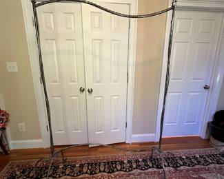 E24 - $150. Fancy - Sturdy Garment Rack. Solid metal. Does NOT come apart. You will need a truck to transport. The tallest part is 77" x 6' long.
