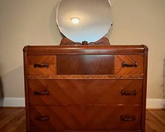 E30 - $150. Measures 43.5" wide x 20" deep x 35.5" tall. Drawers slide. There is minor veneer damage. Mirror looks original.