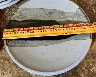 E99 - $100. Set of 8 "HOWE" Pottery Dinner Plates. Measures 8.5" across.