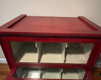 E25 - $650. Antique Cabinet. One Piece. Barrister Style Glass Doors that pull down to protect merchandise. I believe this was also from an old store. Measures 38.25" wide x 26.5" deep x 49" tall.