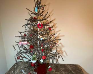 E11 - $95. Vintage Feather Tree (was stuck in the new red pot). Measures 51" tall.