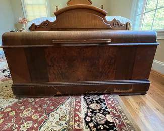 E51 - $50. Roos Cedar Chest. Measures 47" x 19" x 22.5" tall. Cedar on the inside is very nice - veneer needs some repair on the outside.