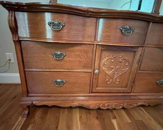 E23 - $250. Lexington Dresser with Mirror. Measures 64" x 21" x 34" tall. Mirror is 48" x 48". Pull for cabinet, bottom middle, needs a new screw.