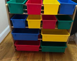 E69 - $30. Toy Sorter with Plastic Baskets. Measures 33.75" x 11.5" deep x 31" tall.