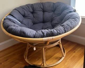 E53 - $40. Papasan Chair with Cushion. Measures 45" round x adjustable heights.
