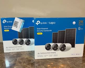 E83 - $100 EACH. TP-Link Tapo Solar-Powered Security Camera Kit. TC85 Kit. Each box has 3 cameras