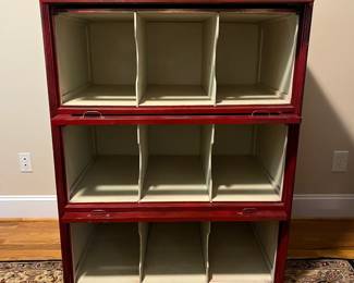 E25 - $650. Antique Cabinet. One Piece. Barrister Style Glass Doors that pull down to protect merchandise. I believe this was also from an old store. Measures 38.25" wide x 26.5" deep x 49" tall.