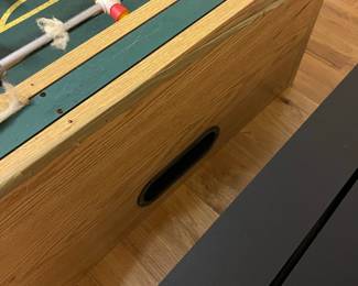 E109 - $50. Foosball Table. Was stored in the attic so the legs were already off. Legs, Hardware & Game Table all included.