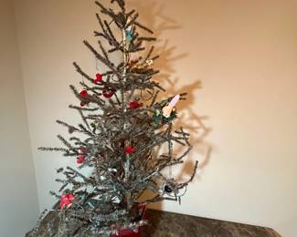 E11 - $95. Vintage Feather Tree (was stuck in the new red pot). Measures 51" tall.